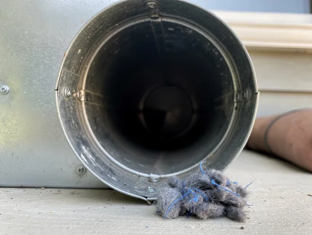 San Jacinto Dryer Vent Cleaning technician using specialized equipment to clear severe dryer vent blockage in San Jacinto
